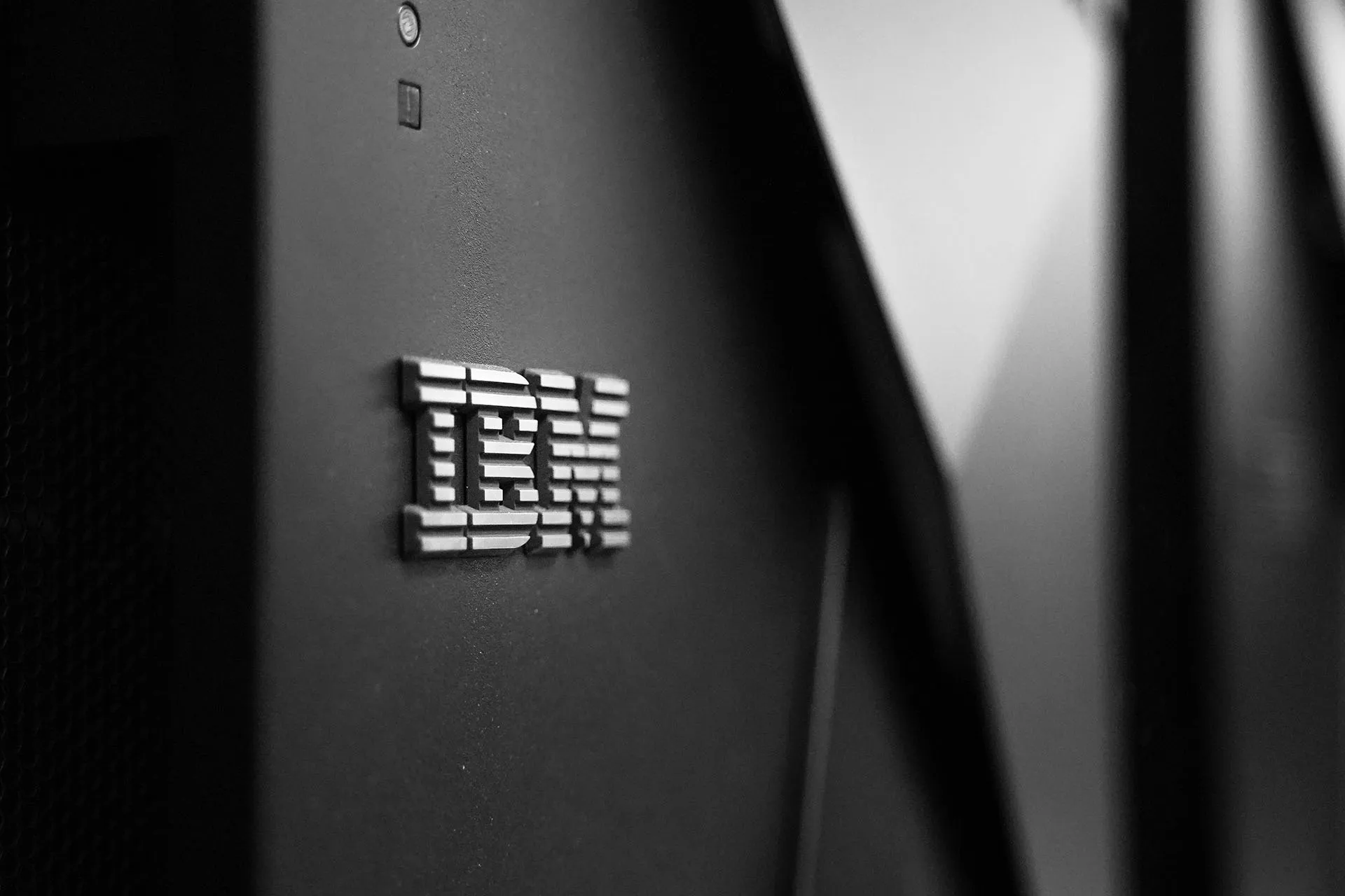  Metal IBM logo on a black wall