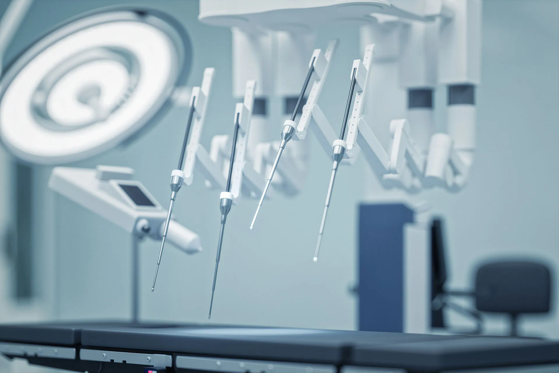 Robotic surgical arms positioned over an operating table in a modern hospital procedure room.